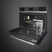 Компактный духовой шкаф с пароваркой Smeg SF4104WVCPN фото 2 в Новосибирске